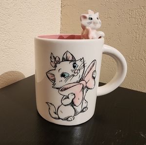 Disney's Aristocats Marie mug. With a little marie hanging on the rim.